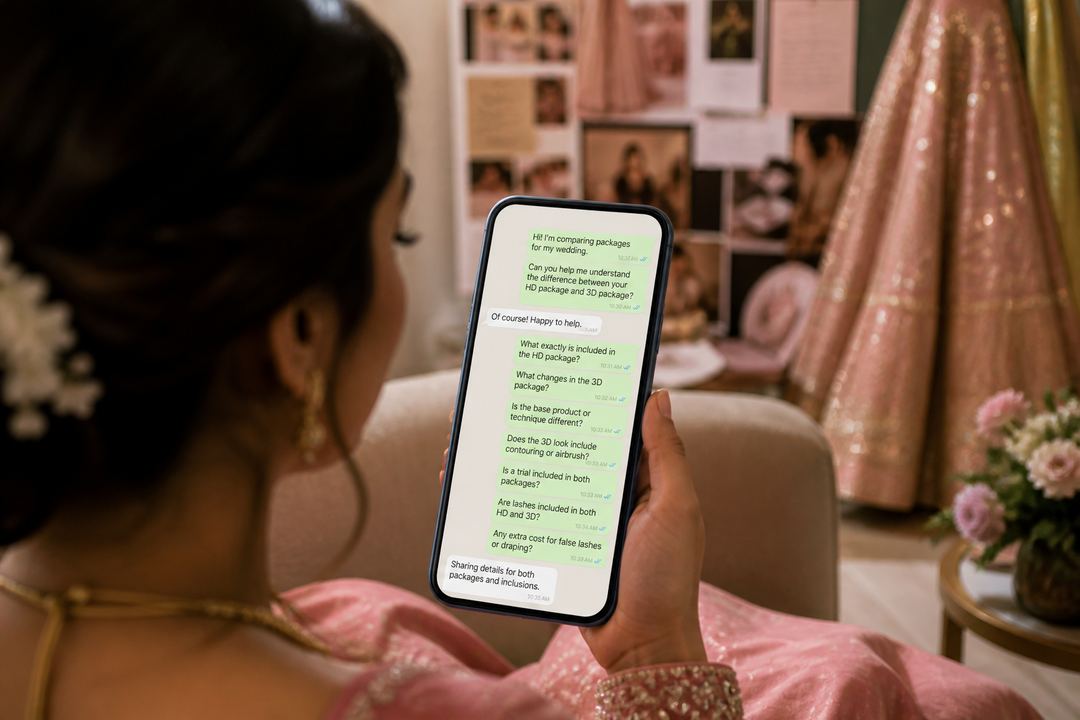 Bride messaging a makeup artist on her phone to clarify HD vs 3D package details and inclusions.