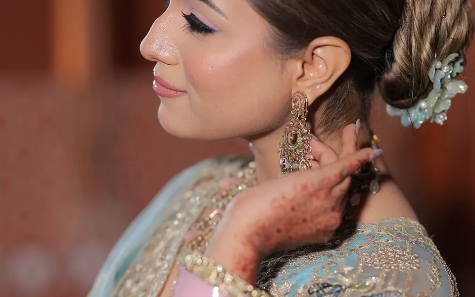 Profile portrait from Lovely Jaiswal’s portfolio showing pink eyeshadow, lashes and softly blended edges.