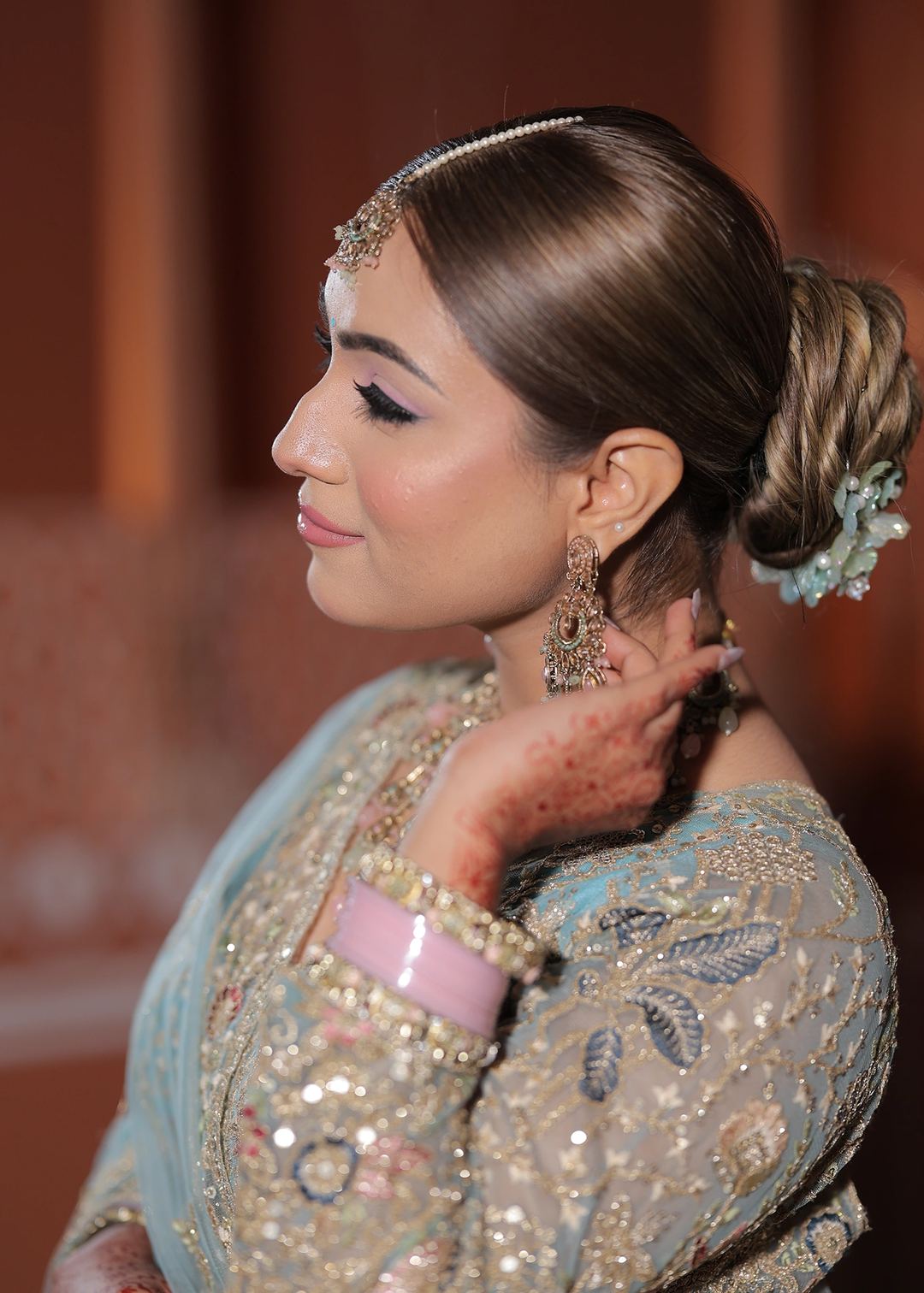 Profile portrait from Lovely Jaiswal’s portfolio showing pink eyeshadow, lashes and softly blended edges.